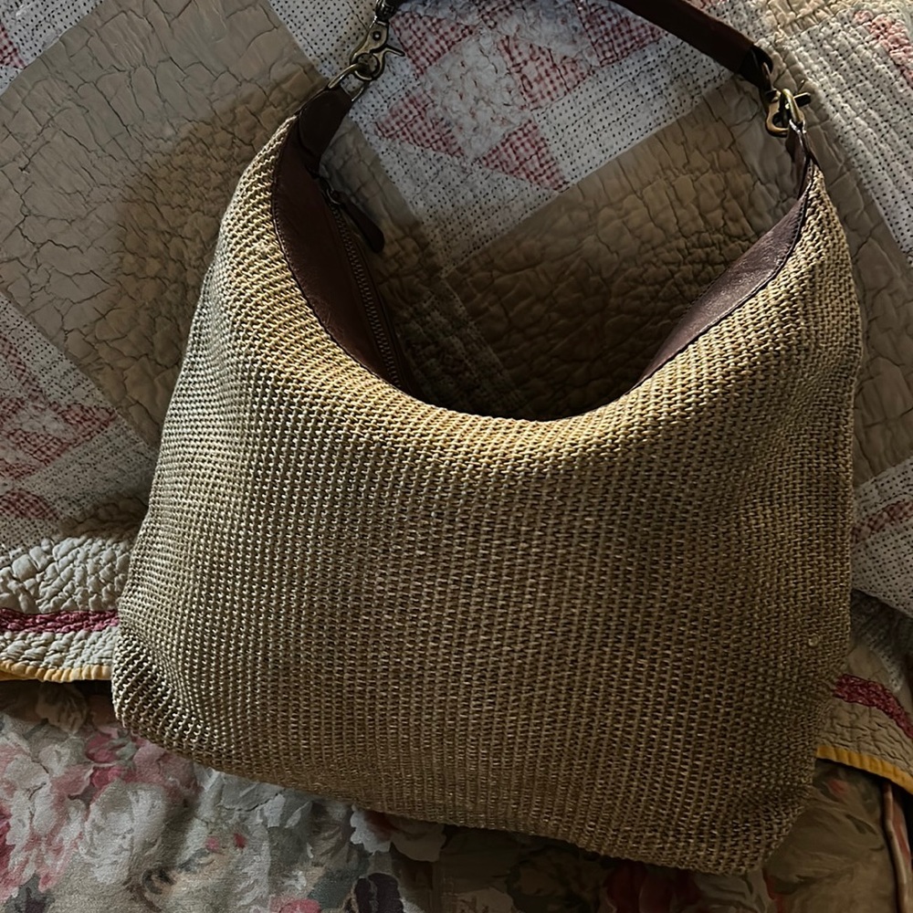 Handsome gold woven Tano bag, with leather trim and strap.